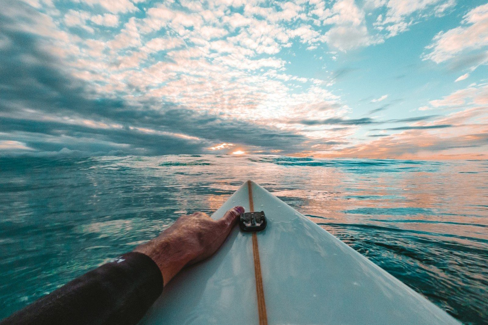 person in black shorts on boat during daytime